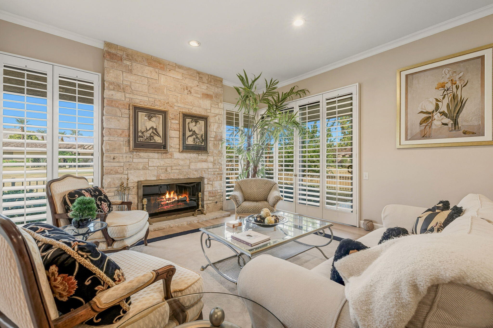 10 Whittier Court Rancho Mirage, CA 92270 - Photo 13 of 62 a living room with furniture flower pot and a fireplace