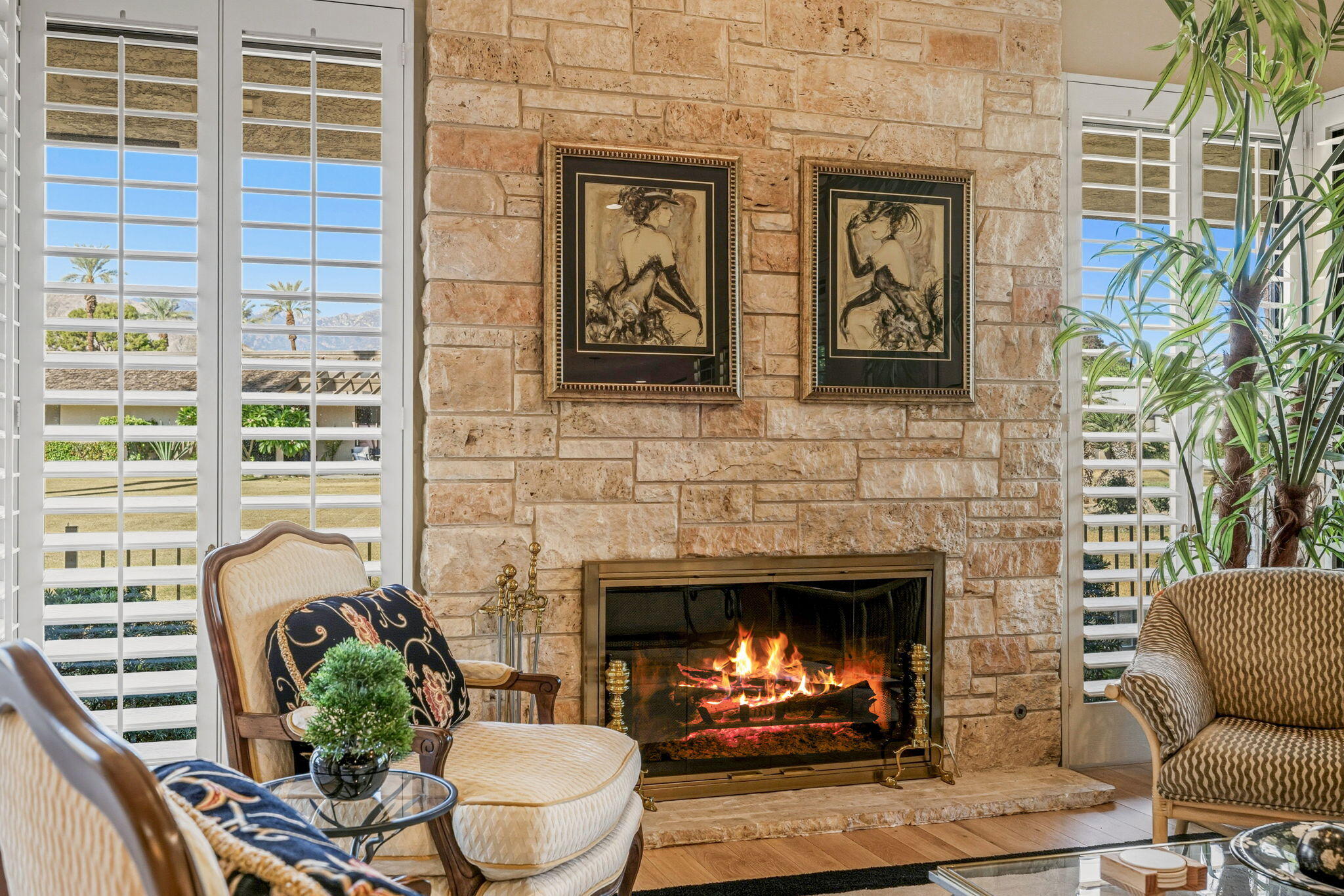 10 Whittier Court Rancho Mirage, CA 92270 - Photo 14 of 62 a living room with furniture a fireplace and a window