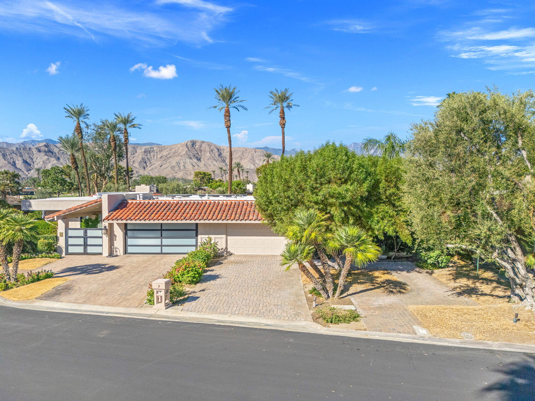 10 Whittier Court Rancho Mirage, CA 92270 - Photo 2 of 62 a view of a swimming pool with a yard