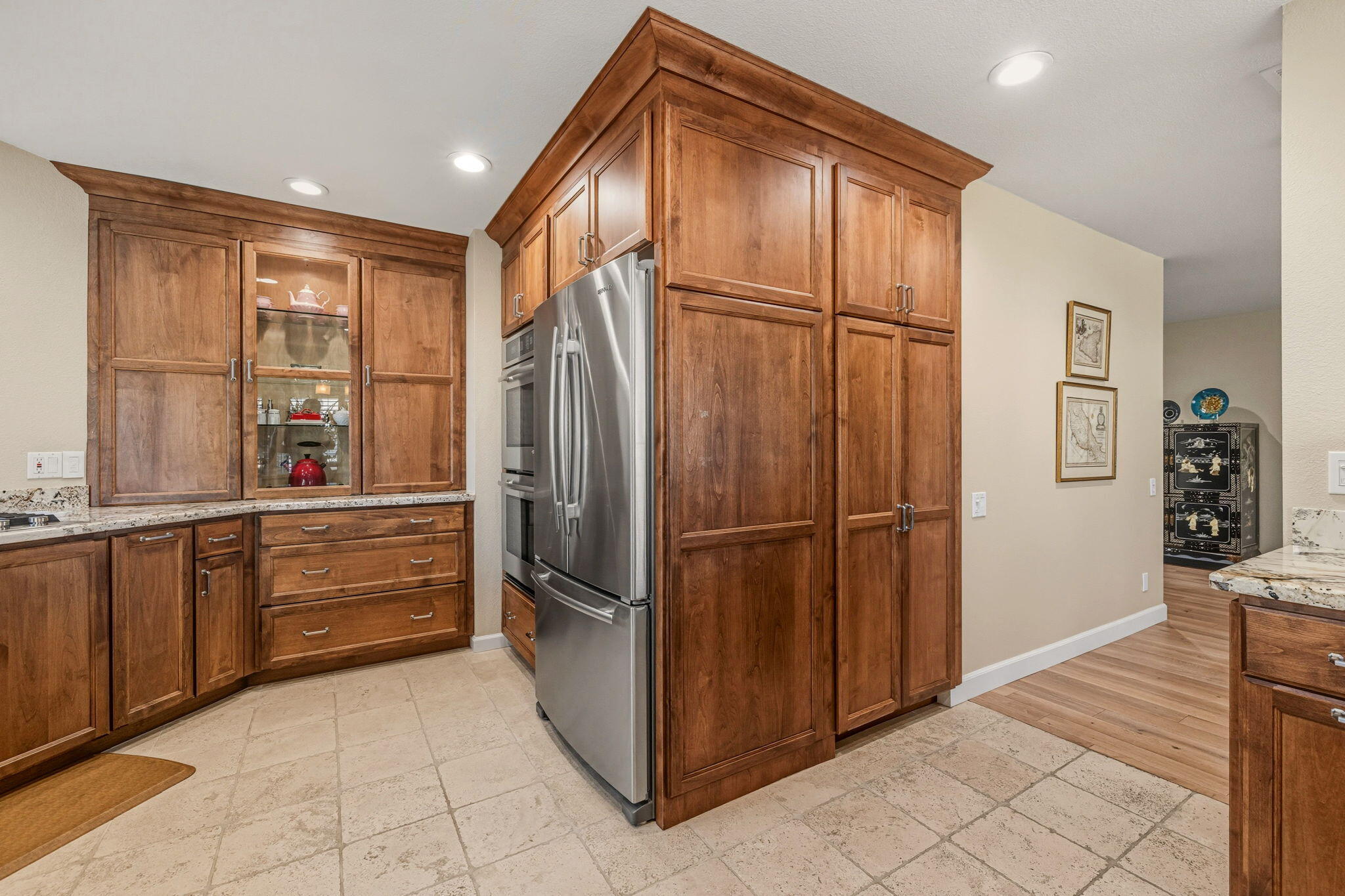 10 Whittier Court Rancho Mirage, CA 92270 - Photo 21 of 62 a kitchen with a refrigerator a sink and cabinets