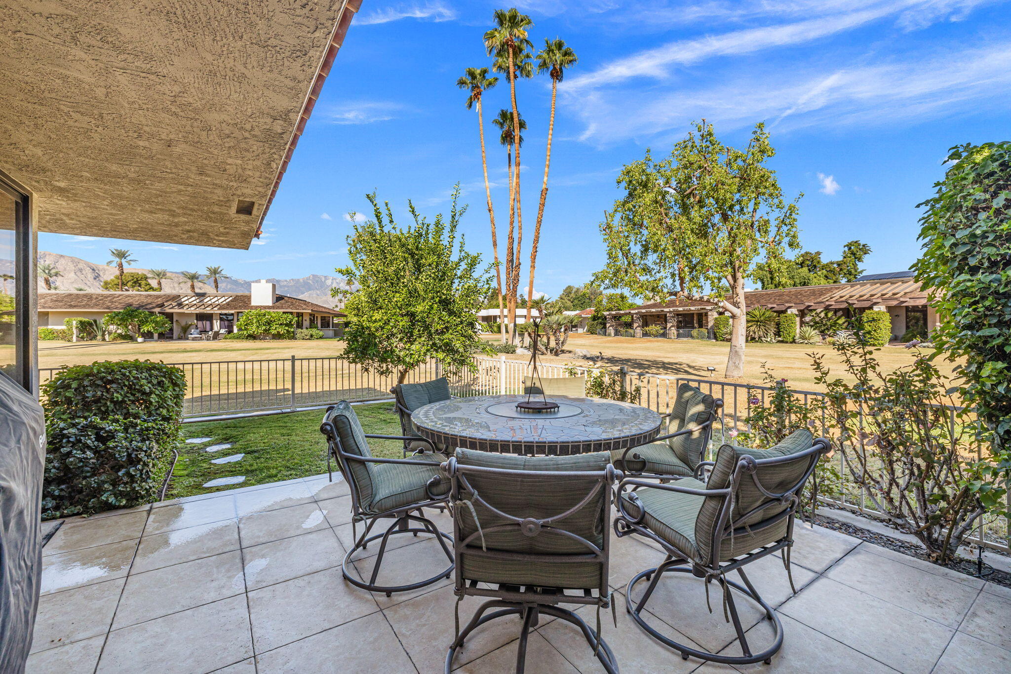10 Whittier Court Rancho Mirage, CA 92270 - Photo 30 of 62 a patio with table and chairs and potted plants