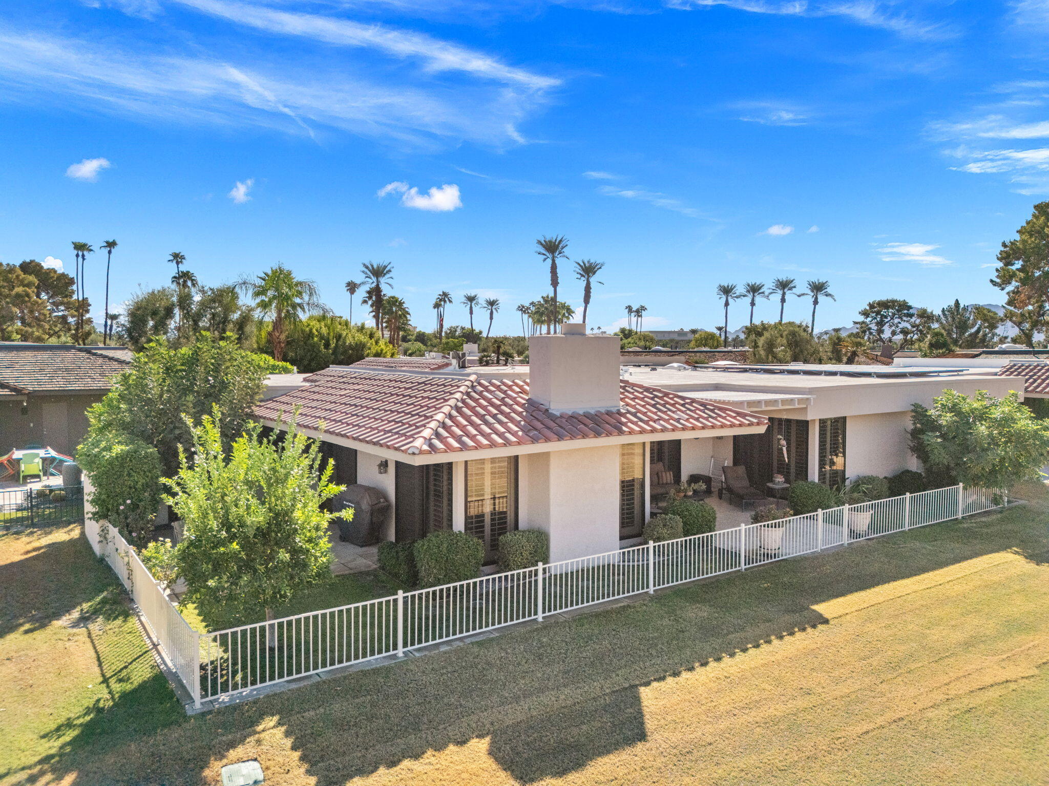 10 Whittier Court Rancho Mirage, CA 92270 - Photo 32 of 62 a view of a house with a swimming pool