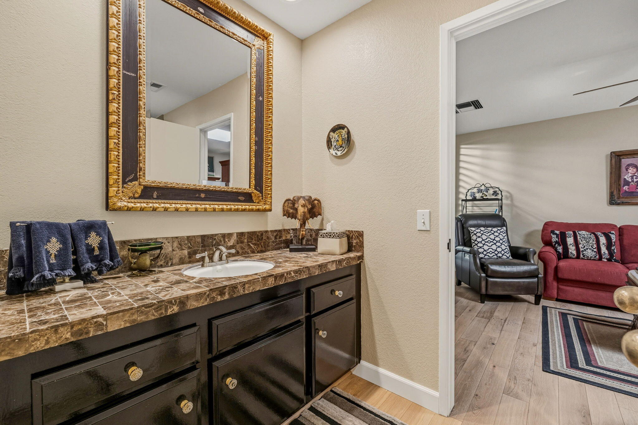 10 Whittier Court Rancho Mirage, CA 92270 - Photo 40 of 62 a bathroom with a granite countertop sink and a mirror