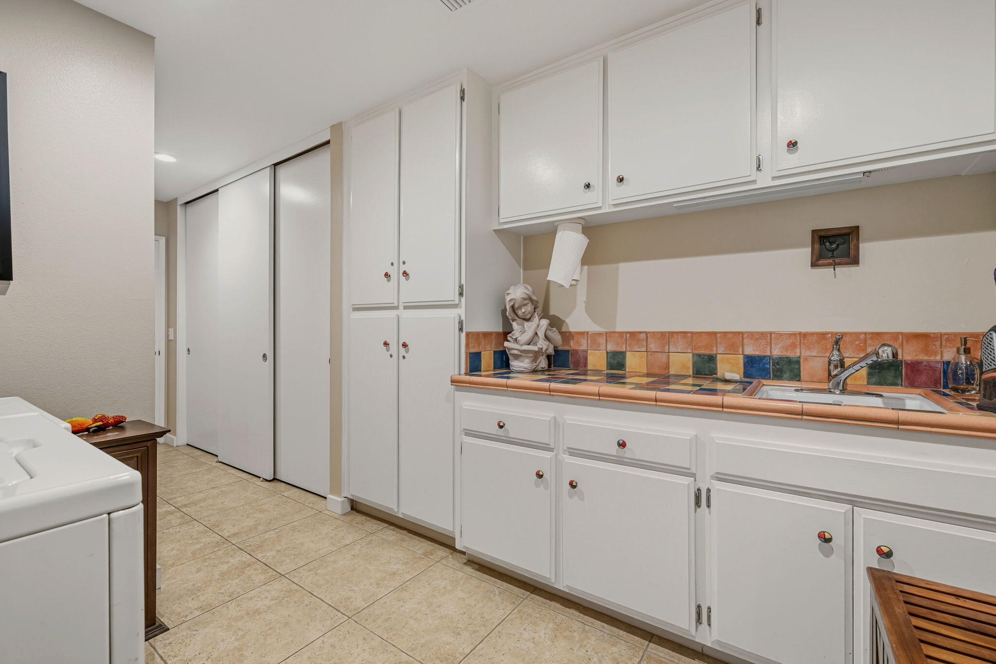 10 Whittier Court Rancho Mirage, CA 92270 - Photo 42 of 62 a kitchen with granite countertop white cabinets and white appliances