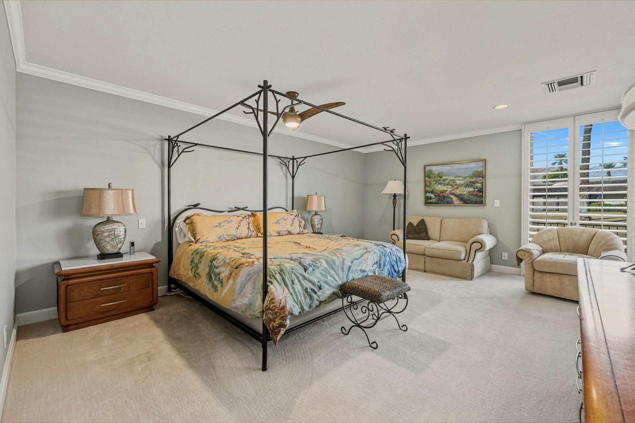 10 Whittier Court Rancho Mirage, CA 92270 - Photo 43 of 62 a bedroom with a bed couch and a window