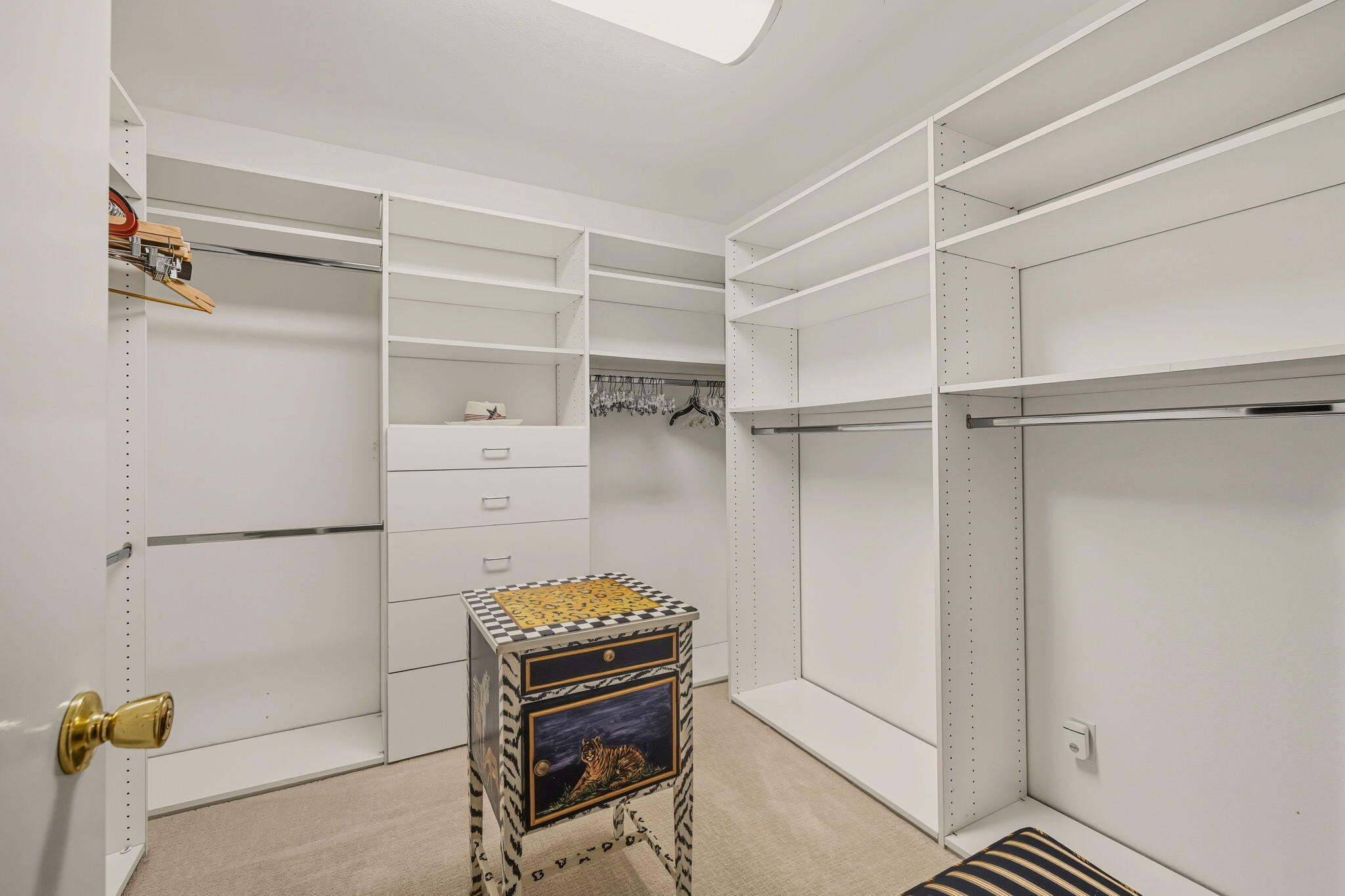 10 Whittier Court Rancho Mirage, CA 92270 - Photo 46 of 62 a room with a closet and wooden shelves