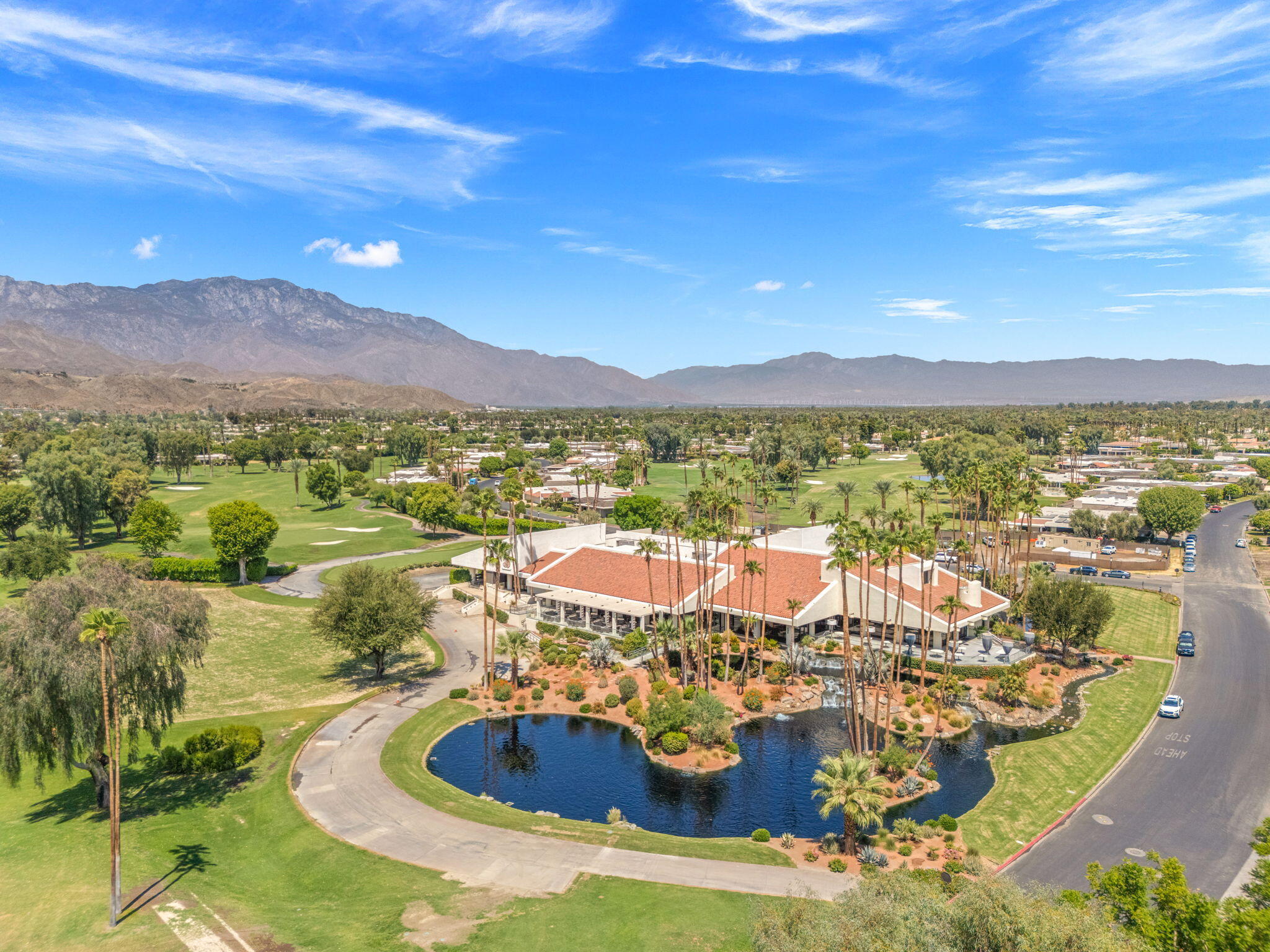 10 Whittier Court Rancho Mirage, CA 92270 - Photo 49 of 62 a view of a swimming pool with a lake view
