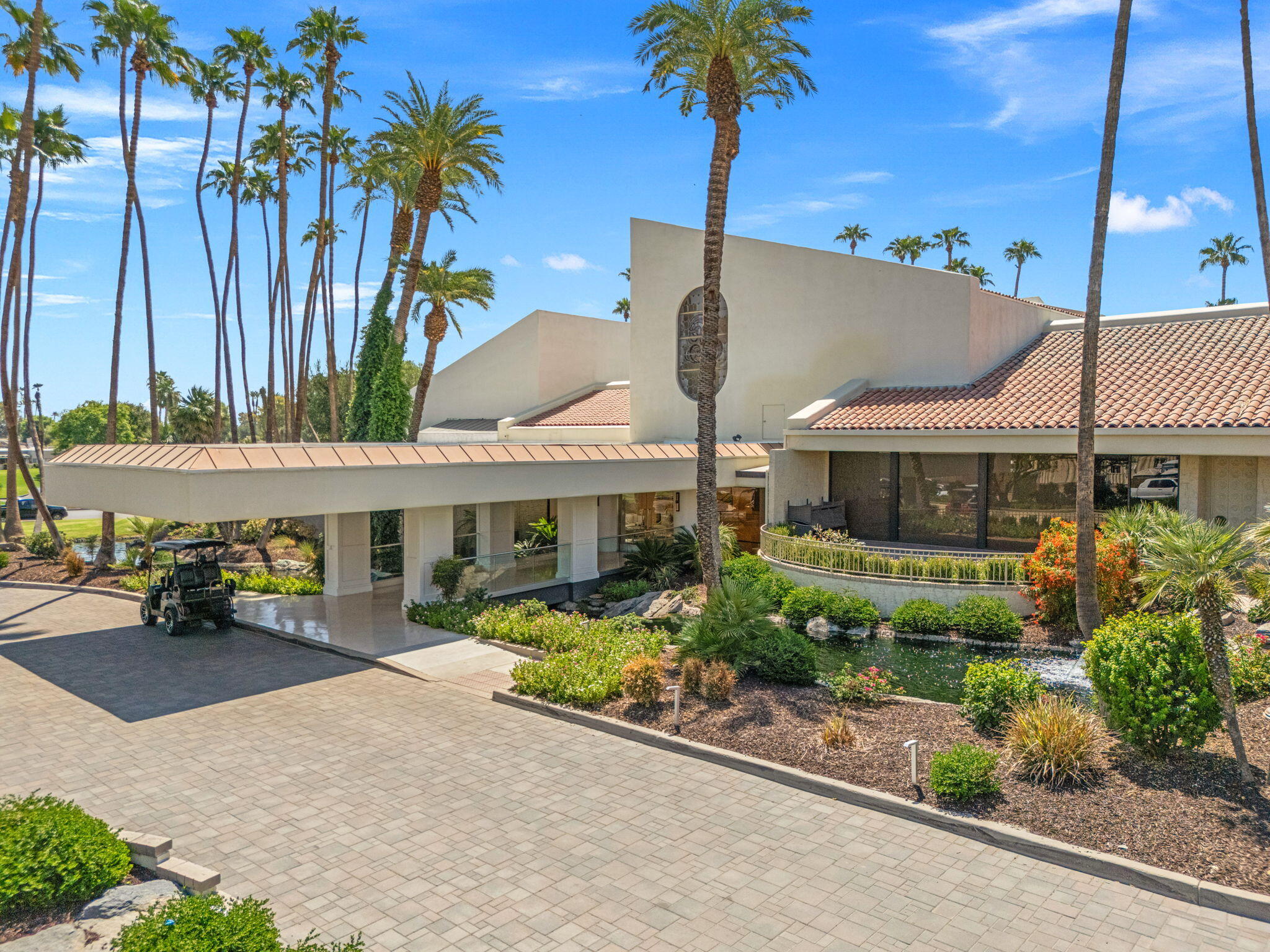 10 Whittier Court Rancho Mirage, CA 92270 - Photo 52 of 62 a front view of a house with garden