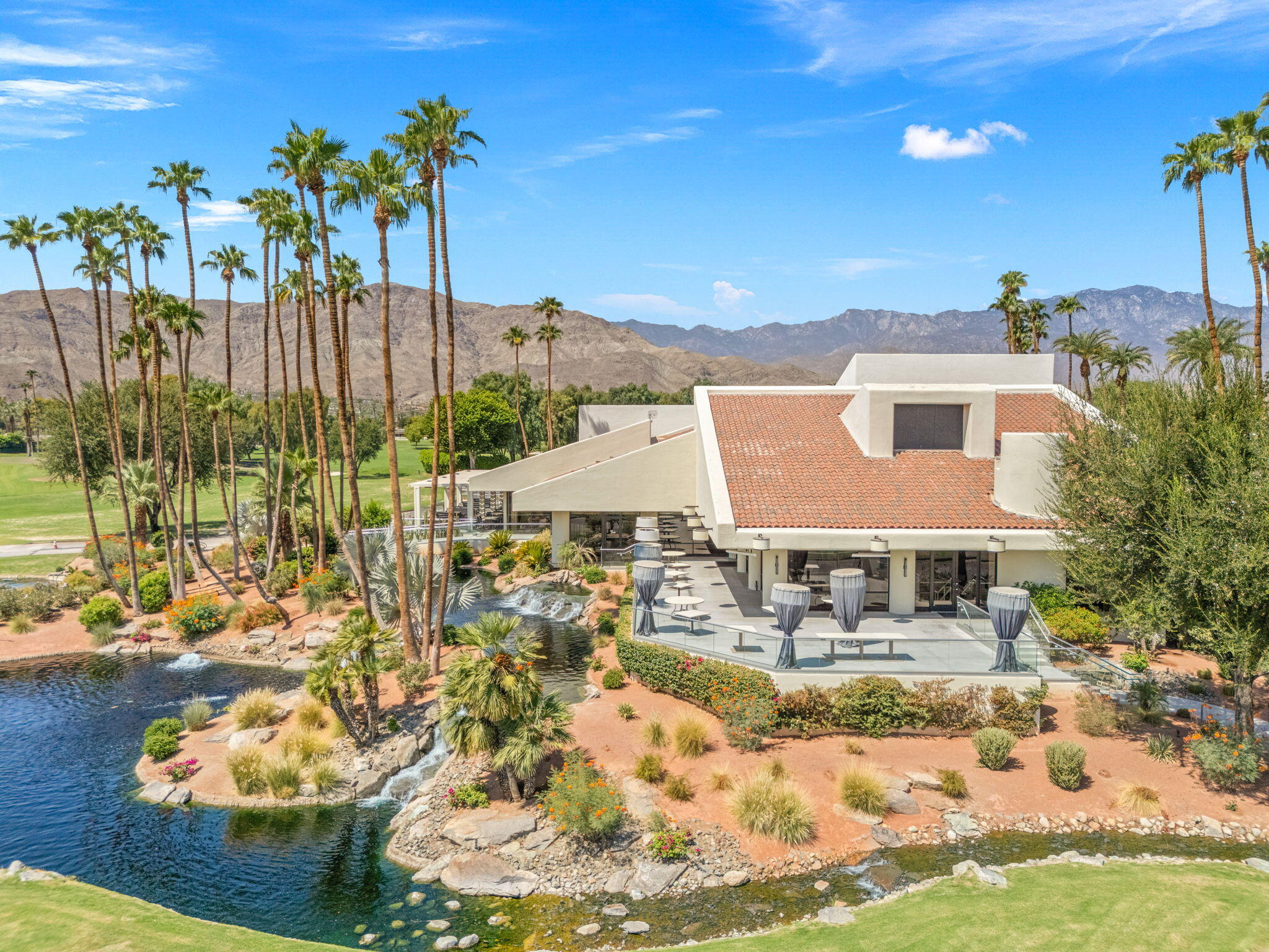 10 Whittier Court Rancho Mirage, CA 92270 - Photo 53 of 62 a view of house with yard swimming pool and outdoor seating