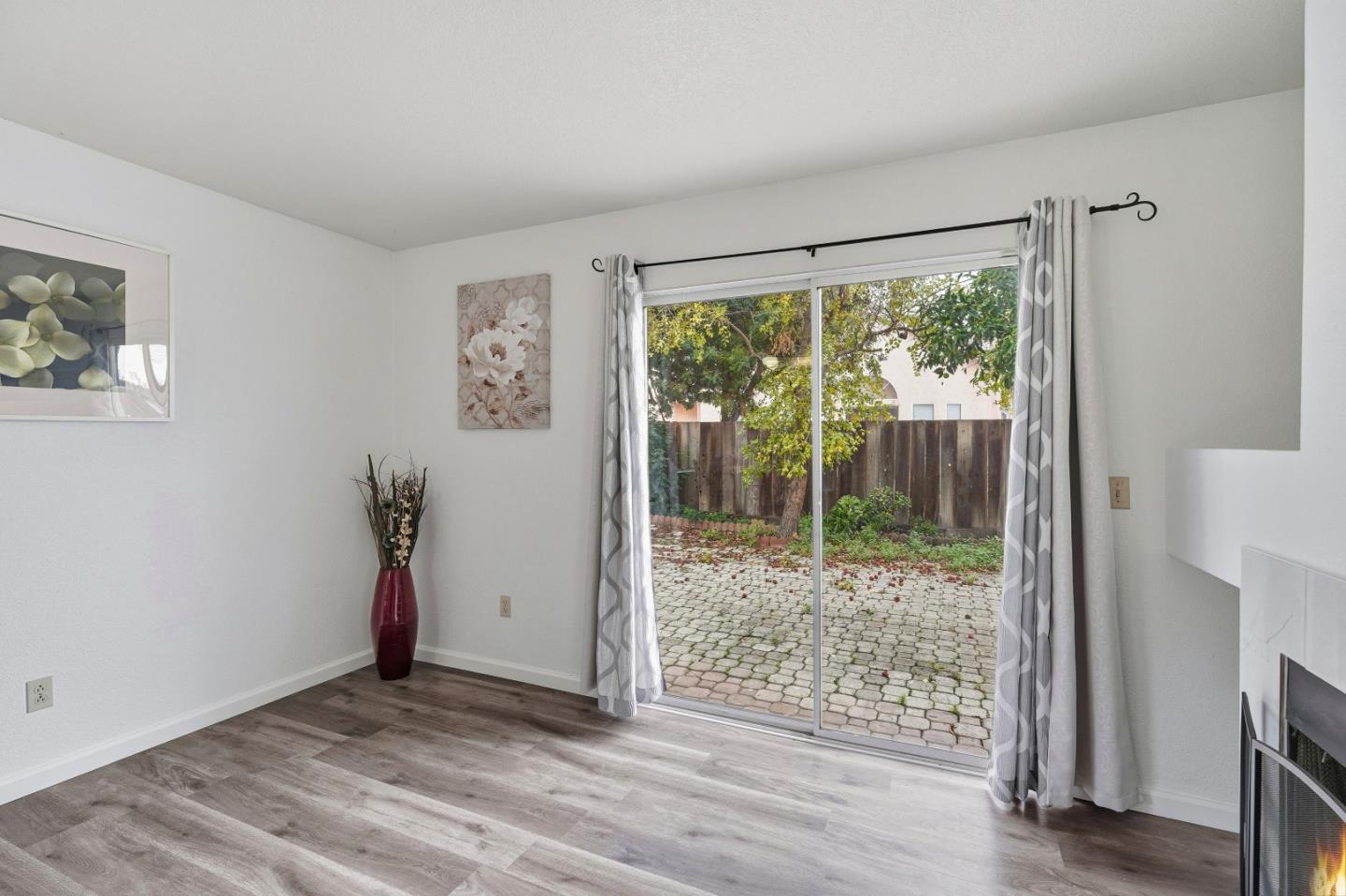 521 Leamon Street Tracy, CA 95376 - Photo 12 of 31 a view of an empty room with wooden floor and a window