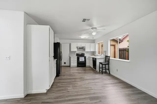 a view of kitchen with wooden floor