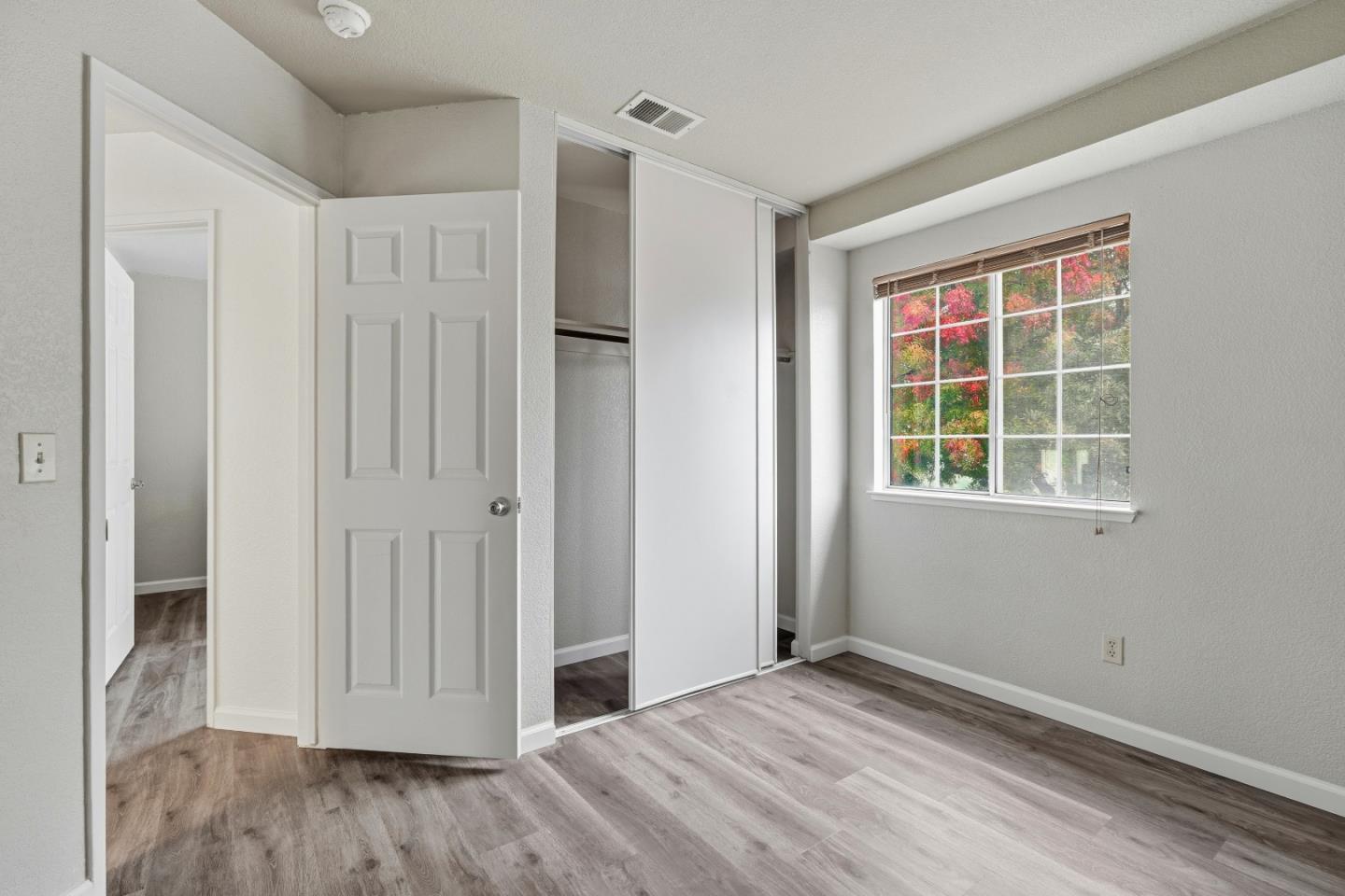 521 Leamon Street Tracy, CA 95376 - Photo 20 of 31 a view of empty room with wooden floor and entryway