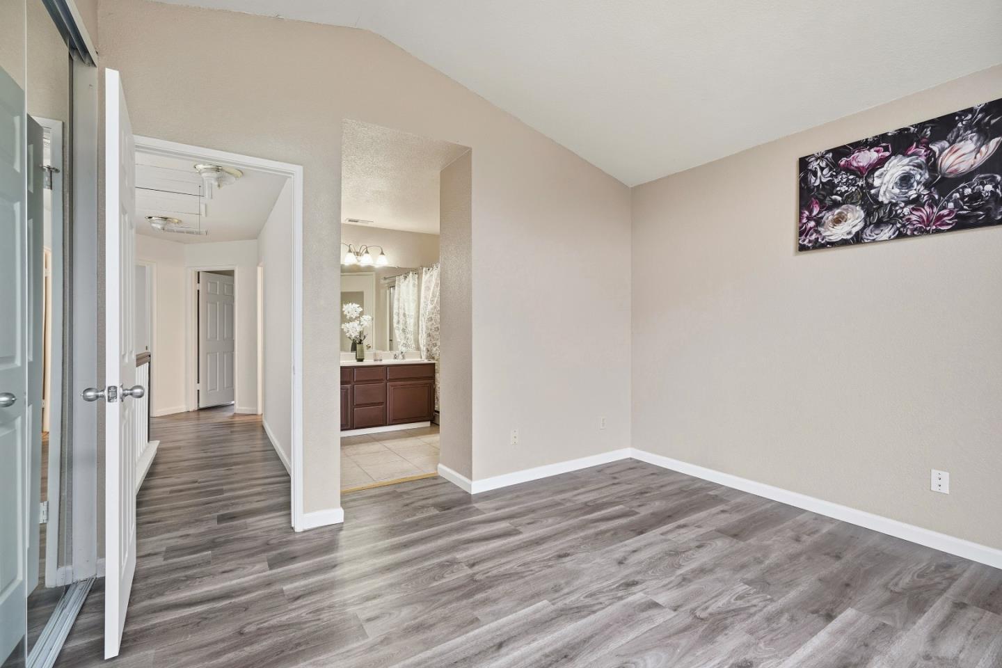 521 Leamon Street Tracy, CA 95376 - Photo 22 of 31 a view of a hallway with wooden floor