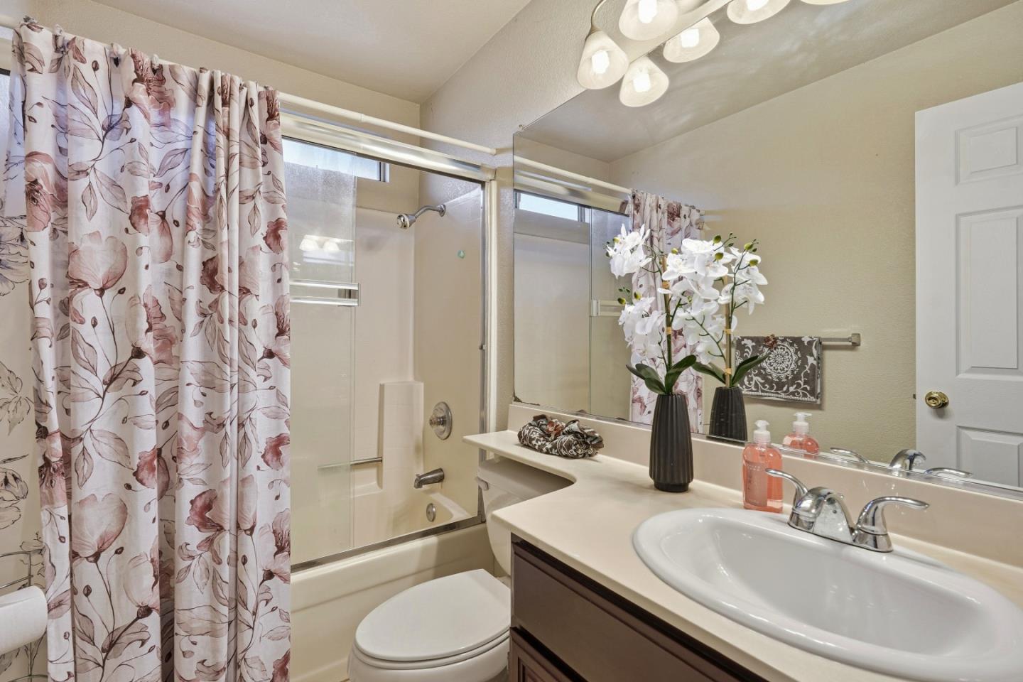 521 Leamon Street Tracy, CA 95376 - Photo 24 of 31 a bathroom with a sink toilet and shower