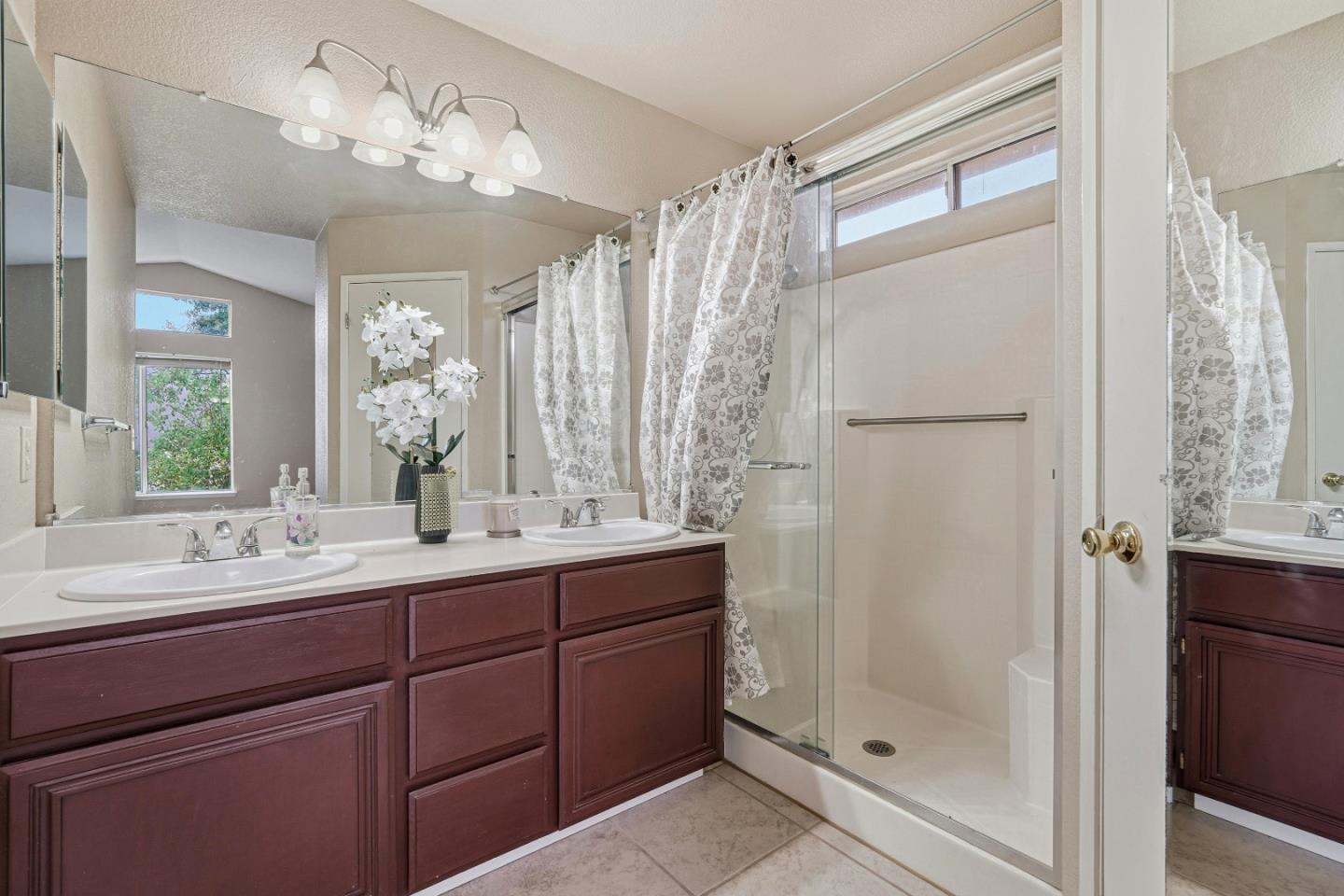 521 Leamon Street Tracy, CA 95376 - Photo 25 of 31 a bathroom with a double vanity sink mirror and shower