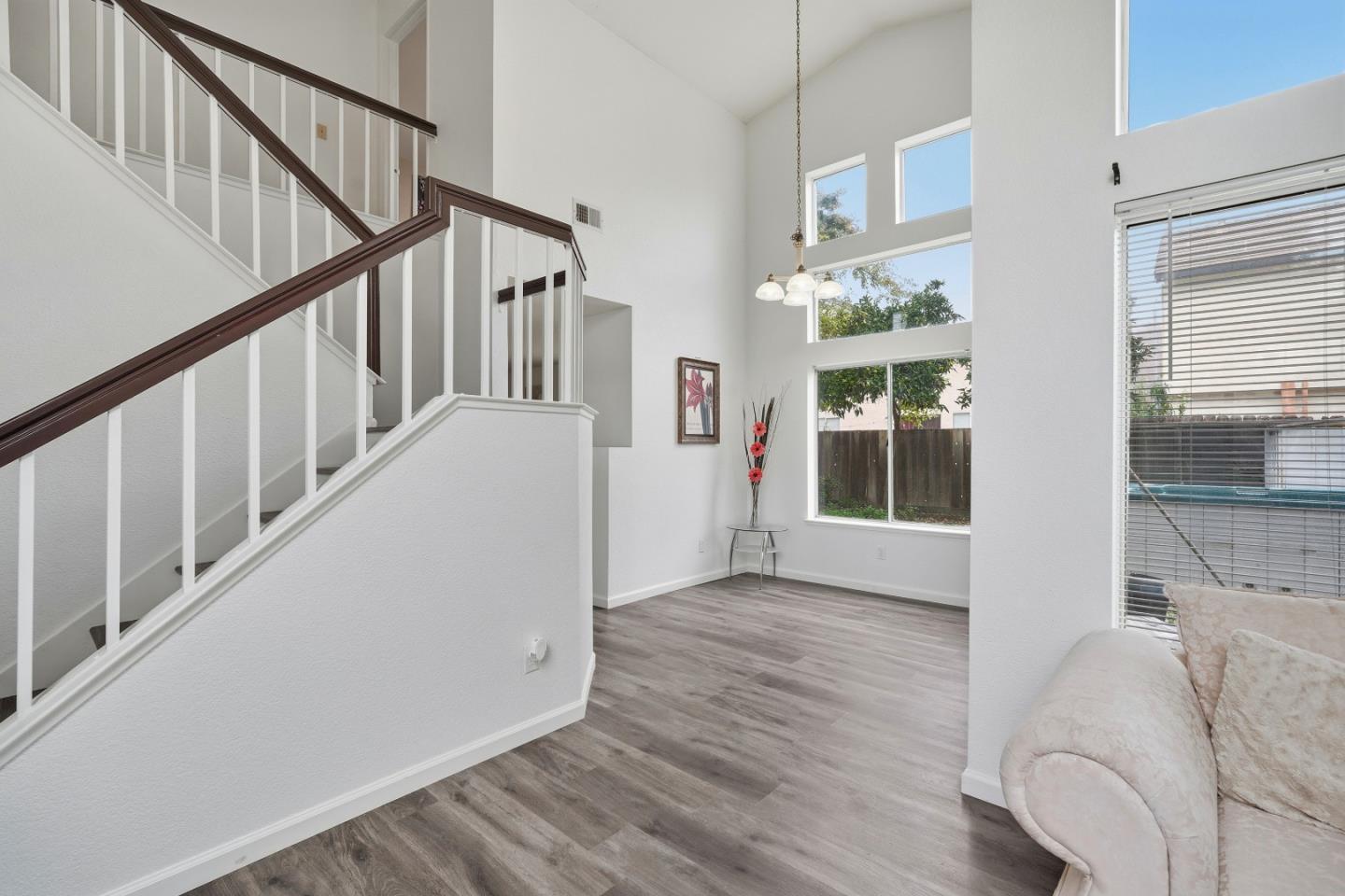 521 Leamon Street Tracy, CA 95376 - Photo 8 of 31 a view of an entryway with wooden floor and stairs