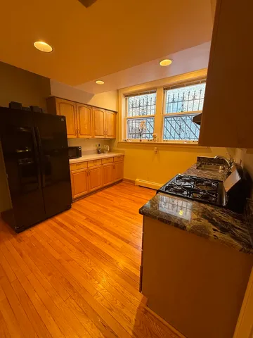 a kitchen with a stove and a refrigerator