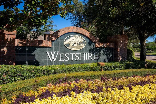 a view of sign board with flower around