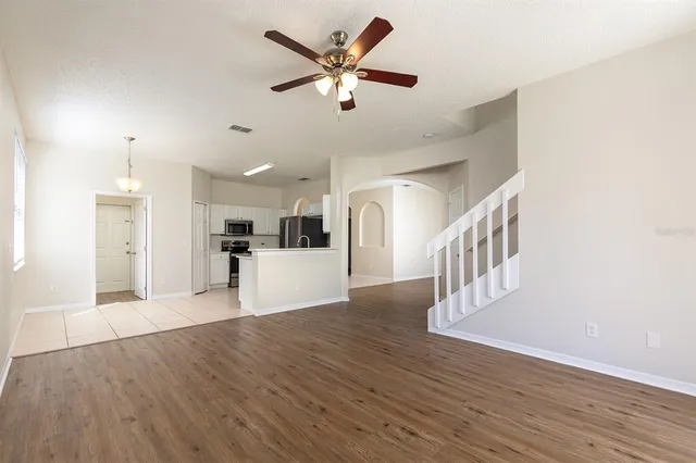 a view of kitchen with cabinets and wooden floor