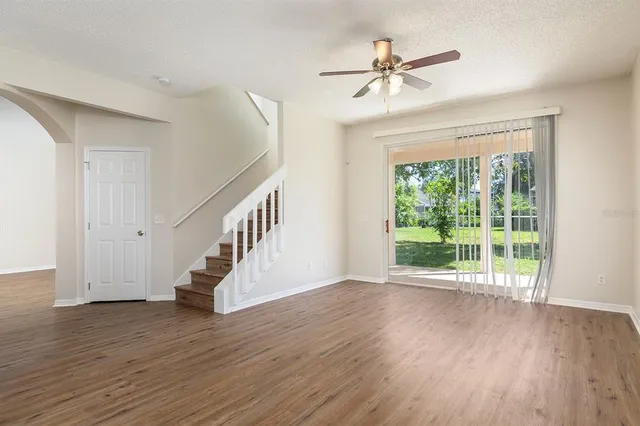 a view of an entryway with wooden floor