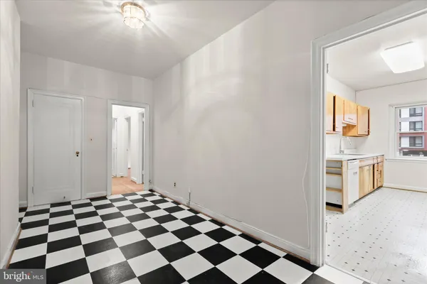a view of a bathroom with a sink and a mirror