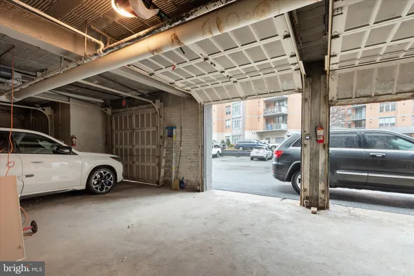 a view of parking garage with cars