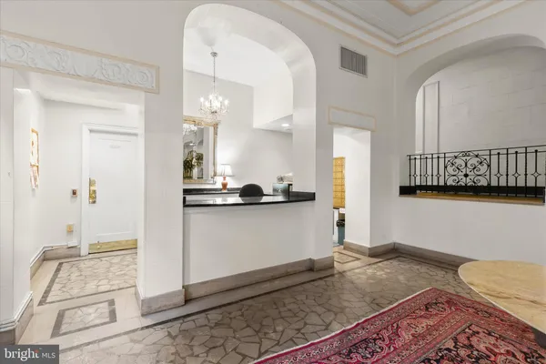 a living room with a bed and a couch