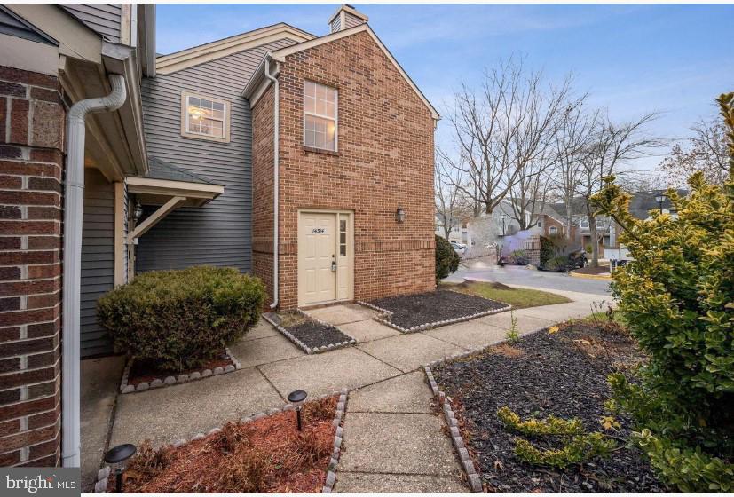 14314 Colonel Clagett Court, Unit 319 Upper Marlboro, MD 20772 - Photo 1 of 15 a view of a house with a yard