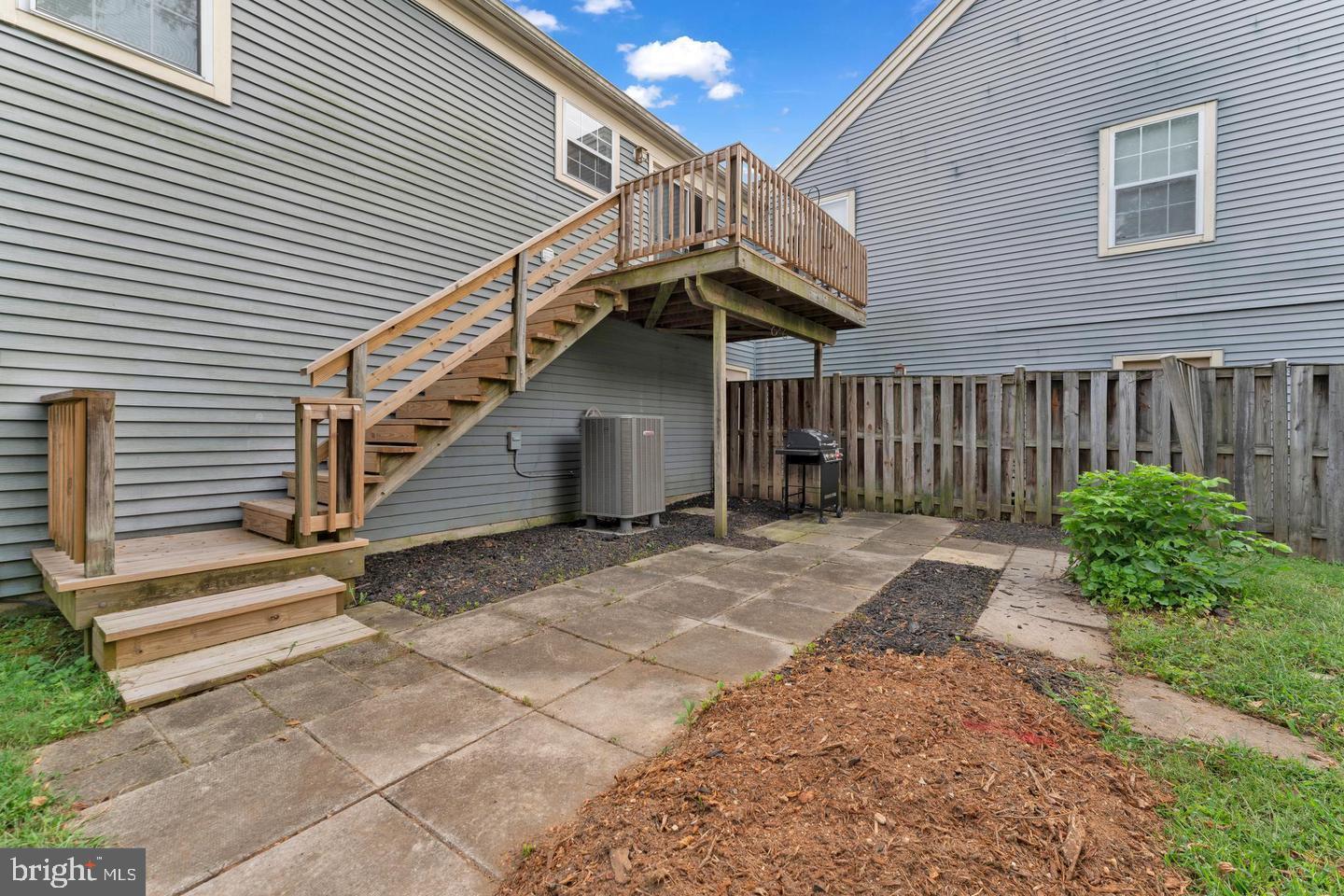 14314 Colonel Clagett Court, Unit 319 Upper Marlboro, MD 20772 - Photo 14 of 15 a view of a house with backyard and stairs
