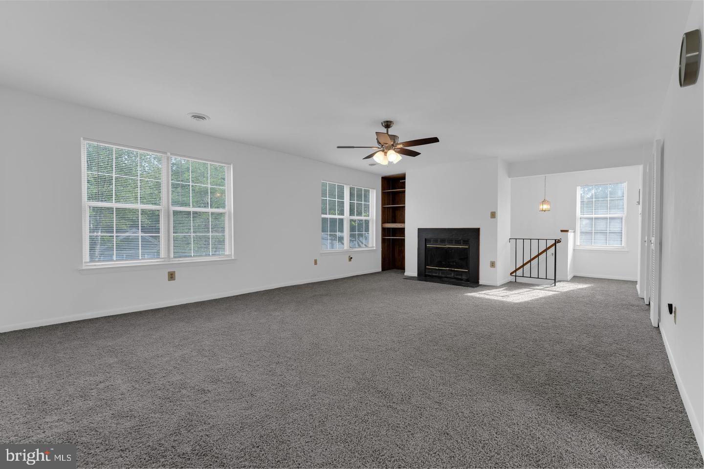 14314 Colonel Clagett Court, Unit 319 Upper Marlboro, MD 20772 - Photo 4 of 15 a view of a livingroom with a fireplace