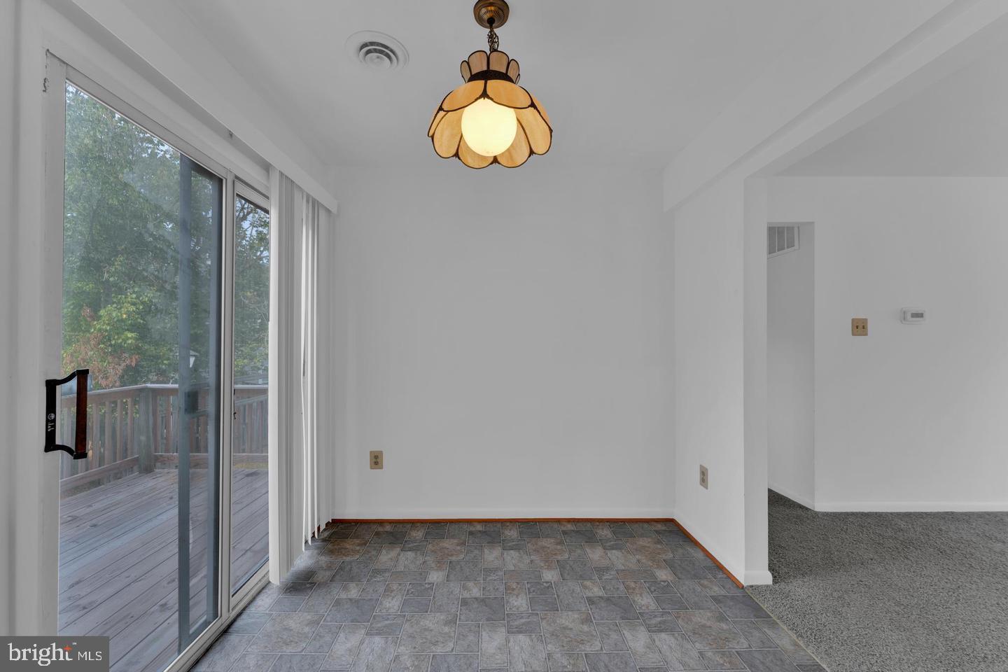 14314 Colonel Clagett Court, Unit 319 Upper Marlboro, MD 20772 - Photo 8 of 15 a view of a livingroom with wooden floor and a large window