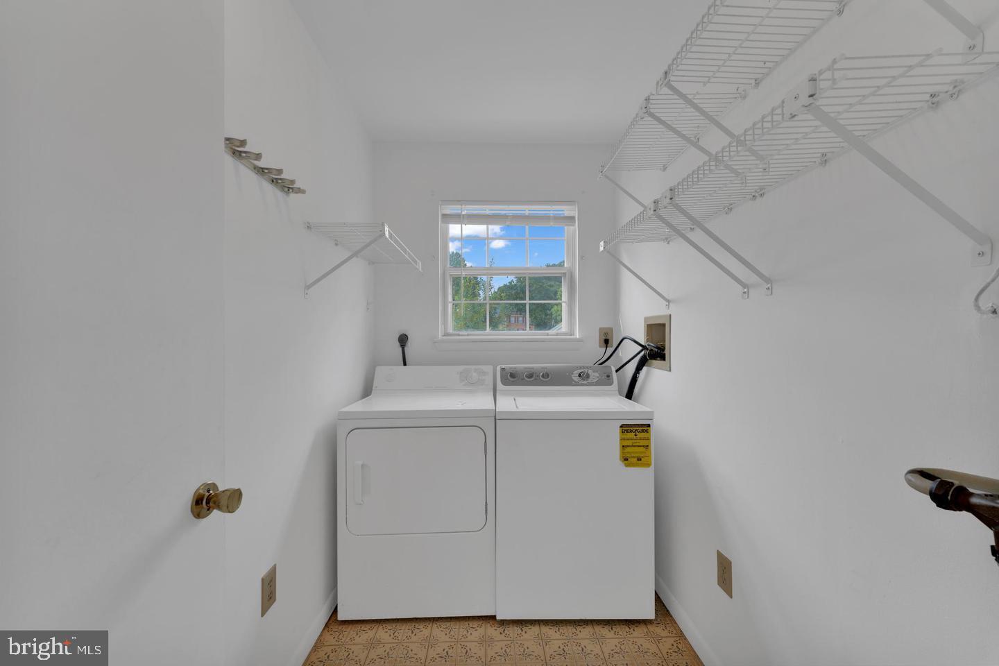 14314 Colonel Clagett Court, Unit 319 Upper Marlboro, MD 20772 - Photo 9 of 15 a utility room with dryer and washer