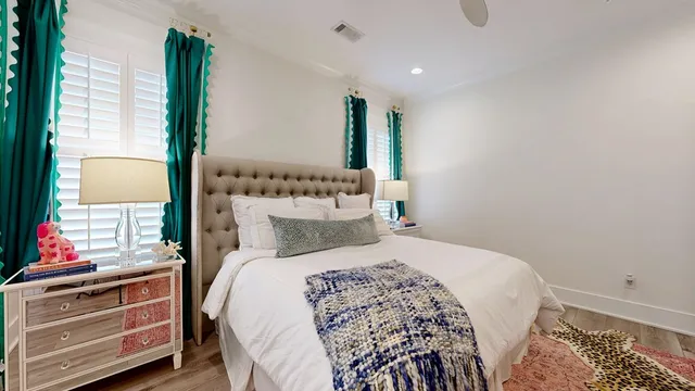 a bedroom with a bed and a dresser