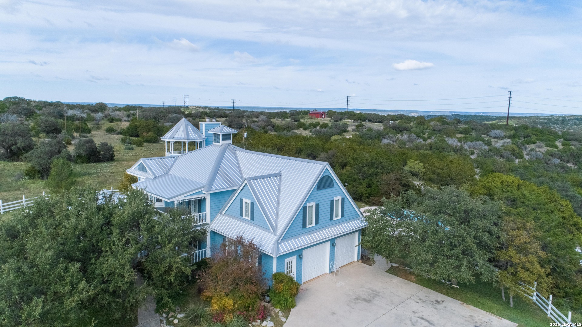 1985 State Loop 481 Junction, TX 76849 - Photo 1 of 37 an aerial view of a house with swimming pool and mountains