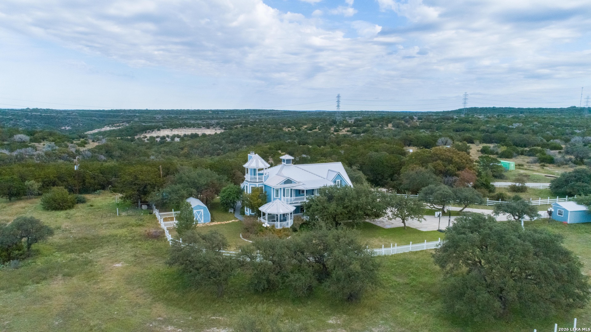 1985 State Loop 481 Junction, TX 76849 - Photo 14 of 37 an aerial view of a house with a yard