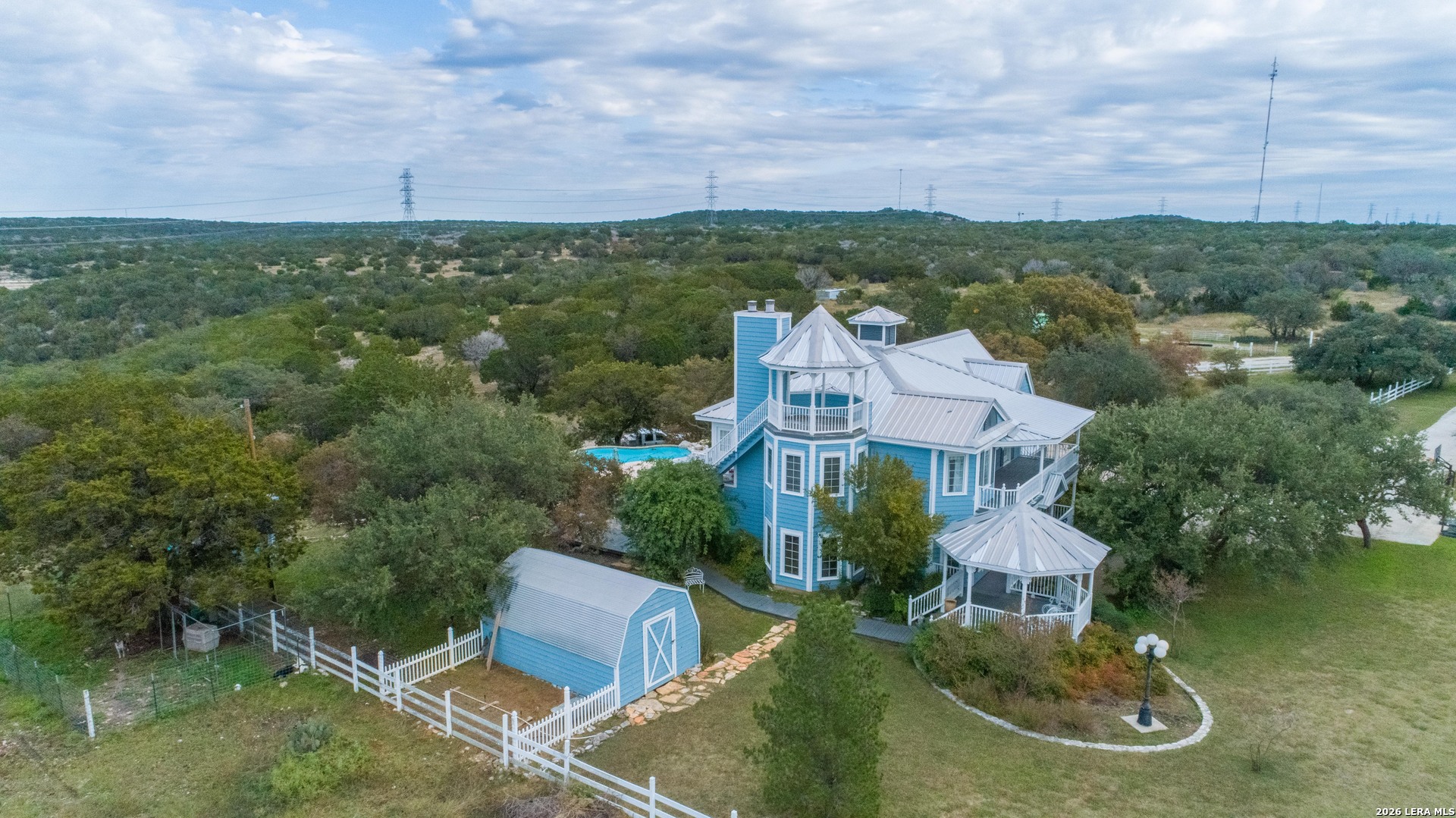 1985 State Loop 481 Junction, TX 76849 - Photo 15 of 37 an aerial view of a house with a garden and lake view
