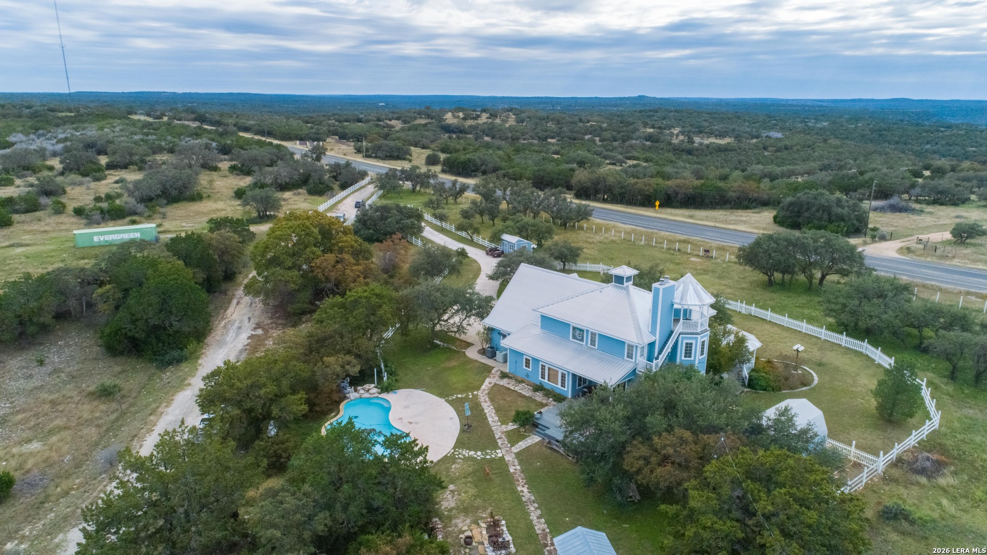 1985 State Loop 481 Junction, TX 76849 - Photo 16 of 37 an aerial view of a house with a garden and lake view
