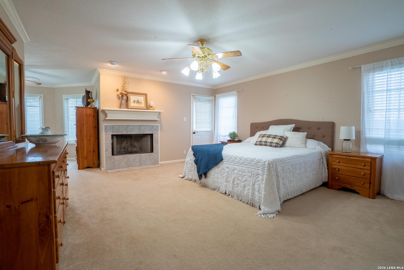 1985 State Loop 481 Junction, TX 76849 - Photo 27 of 37 a spacious bedroom with a bed and a fireplace