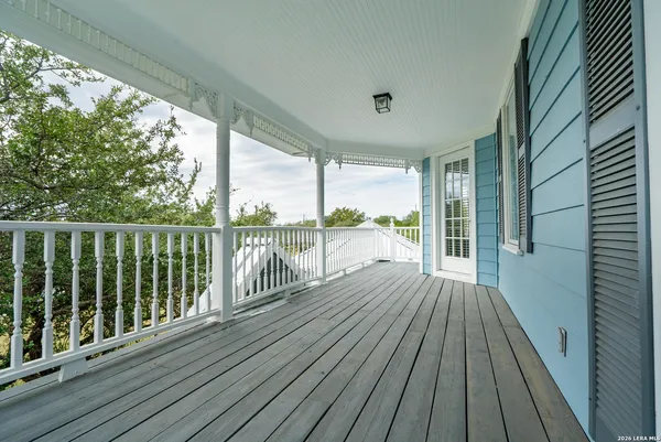 a view of a deck with wooden floor and outdoor seating