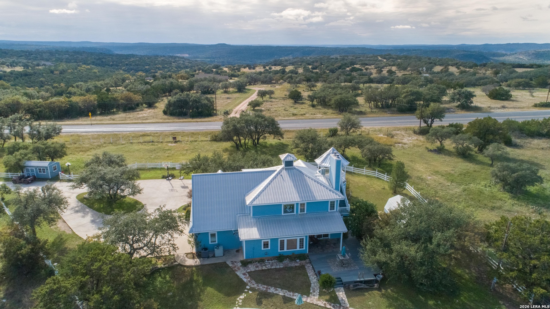 1985 State Loop 481 Junction, TX 76849 - Photo 4 of 37 an aerial view of residential houses with outdoor space and river