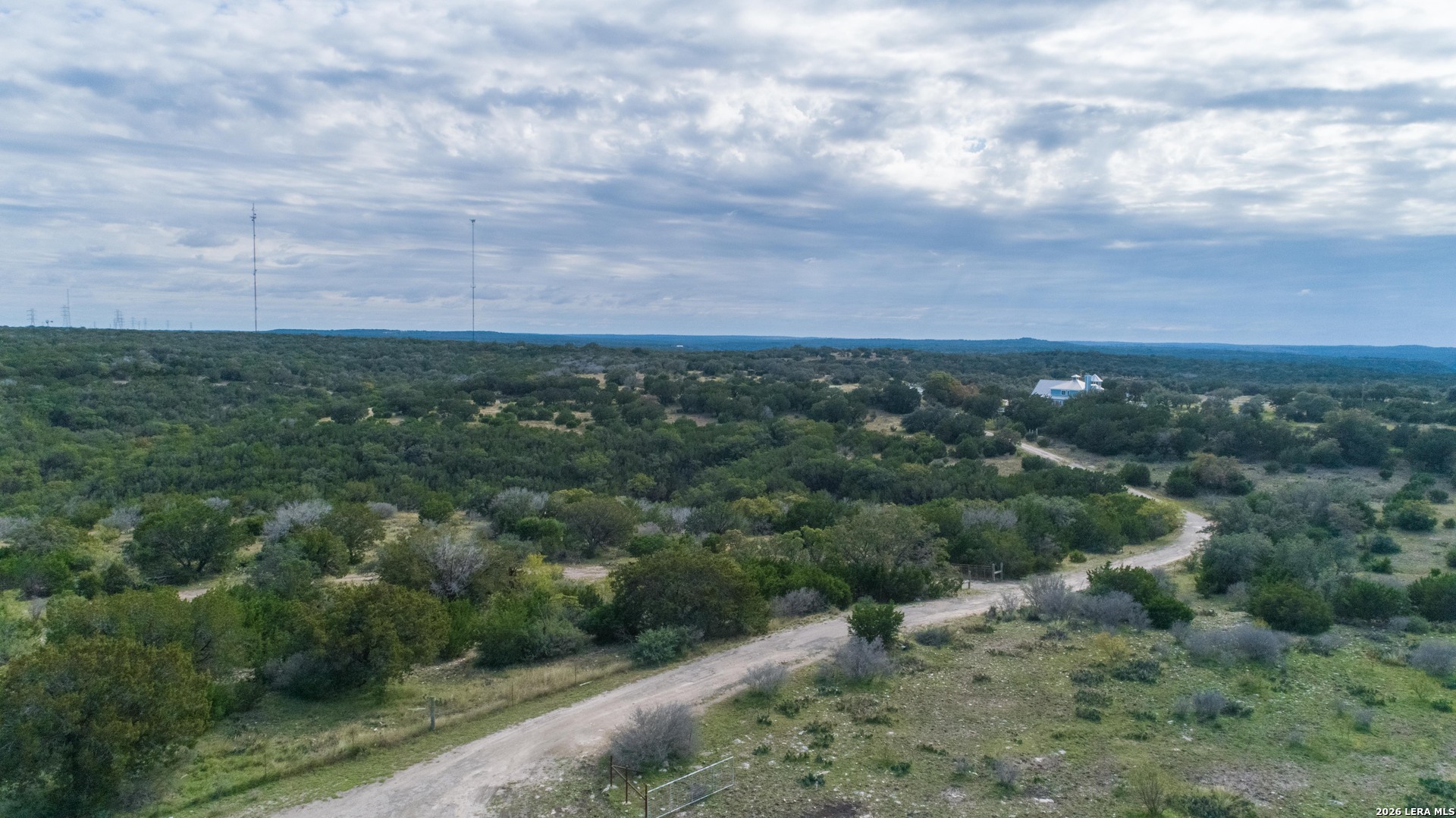 1985 State Loop 481 Junction, TX 76849 - Photo 8 of 37 an aerial view of houses covered in trees
