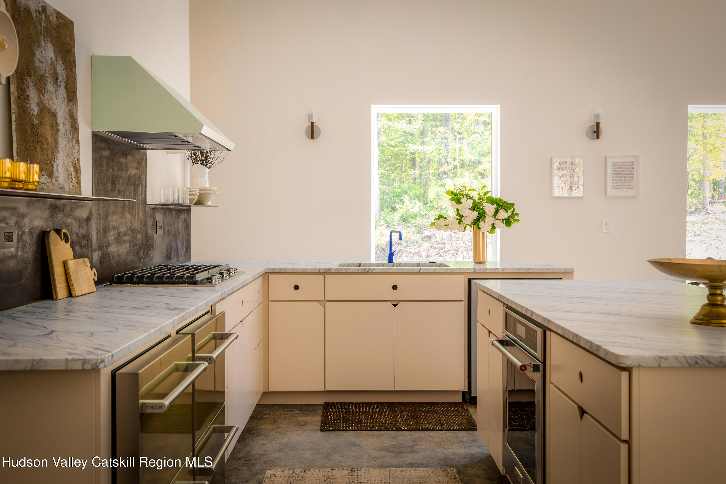 54 Langridge Road Tivoli, NY 12583 - Photo 12 of 40 a kitchen with a sink stove and cabinets