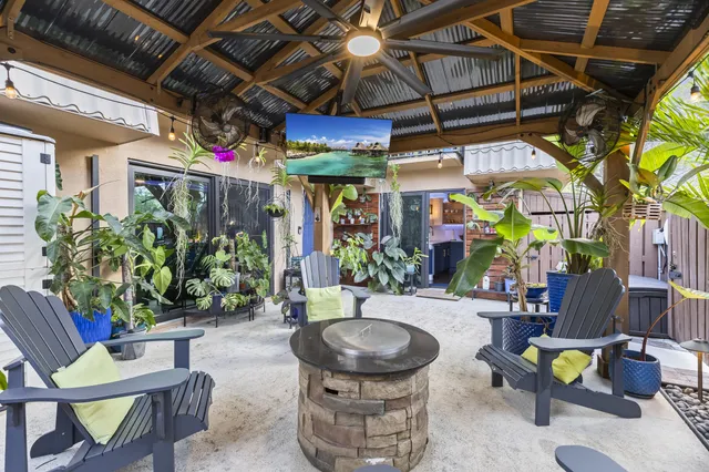 a view of a chairs and tables in patio