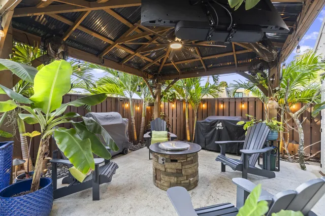 a view of a chairs and table in a patio