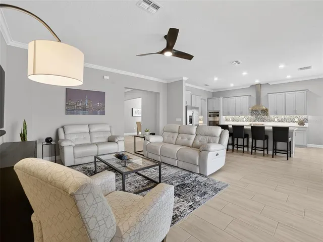 a view of a livingroom with furniture and a window