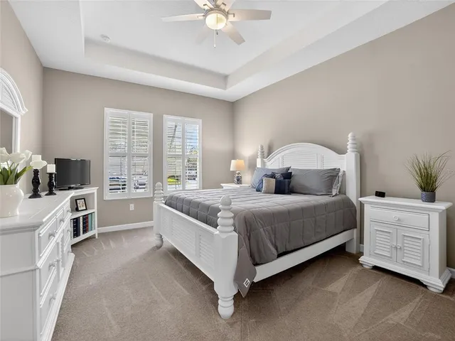 a view of a lake with houses in the back