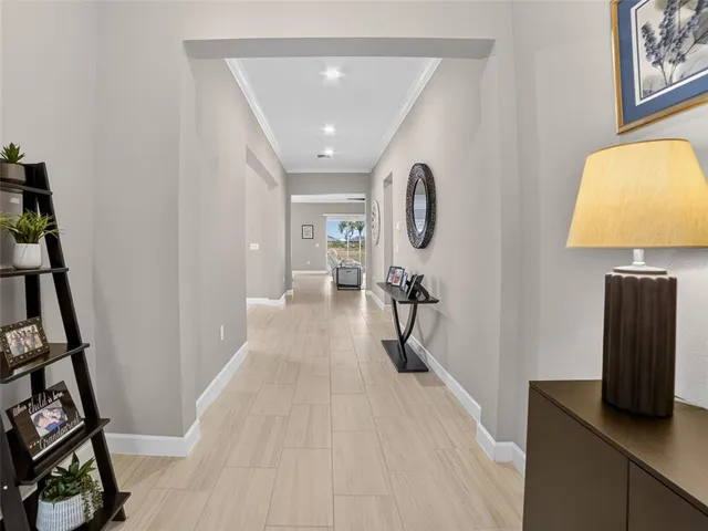 a living room with furniture a flat screen tv and a window