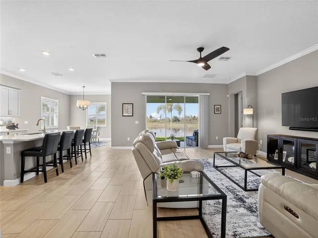 a spacious bathroom with a granite countertop sink a mirror and a shower