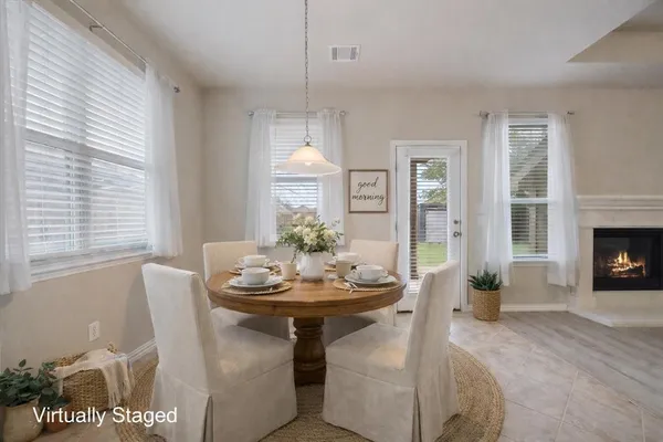 a dining room with furniture a livingroom and chandelier