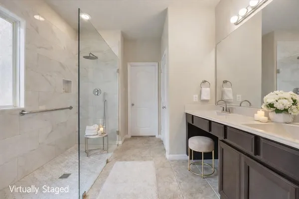 a spacious bathroom with a granite countertop sink a toilet and shower